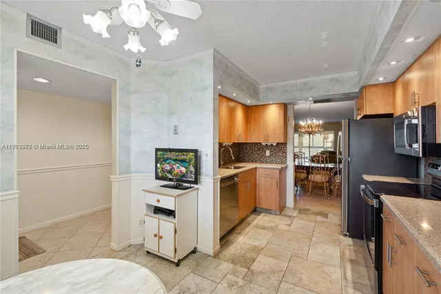 a kitchen with a refrigerator and a sink