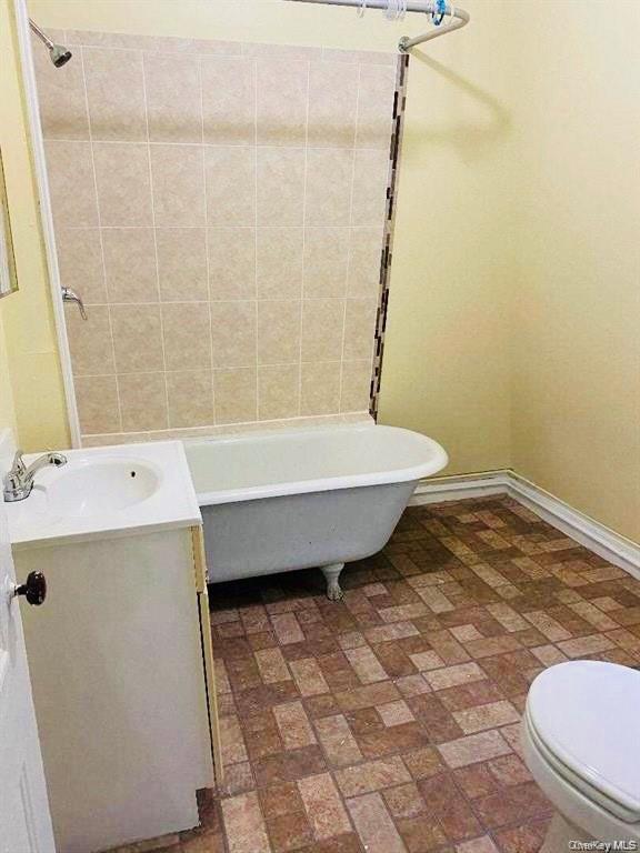 139 Montgomery Street, Unit 3 Poughkeepsie, NY 12601 - Photo 5 of 5 a bathroom with a sink toilet and shower