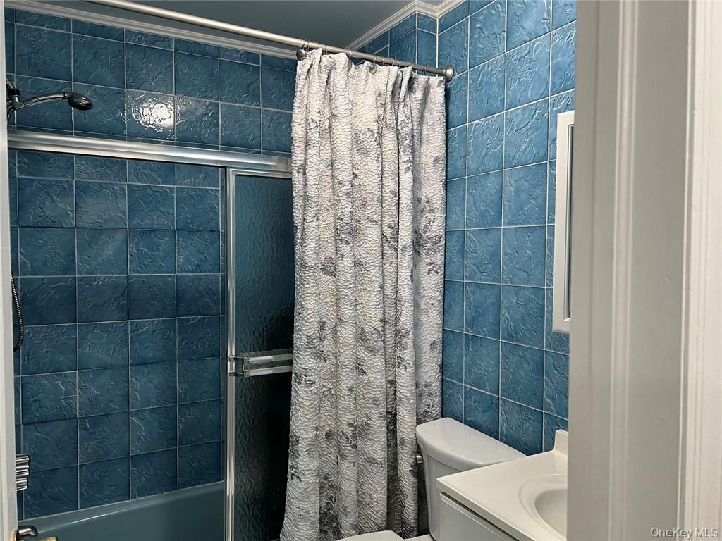 39 Wilmot Road, Unit 1 Scarsdale, NY 10583 - Photo 16 of 18 a bathroom with a shower and a sink
