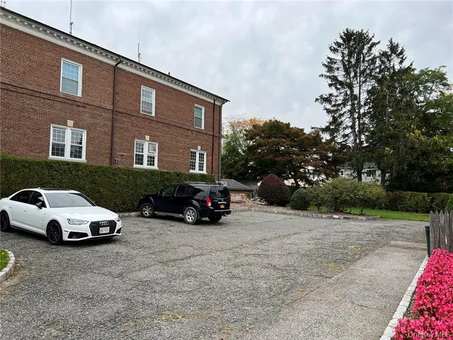 a view of a car parked in front of a building