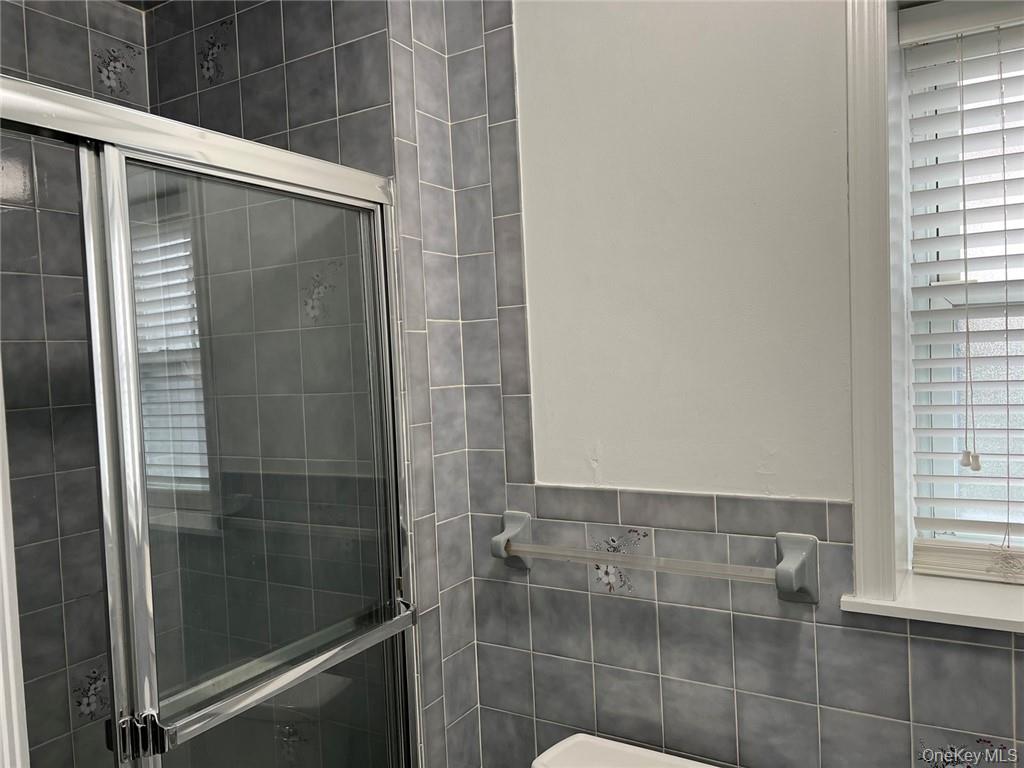 39 Wilmot Road, Unit 1 Scarsdale, NY 10583 - Photo 10 of 18 a bathroom with a shower