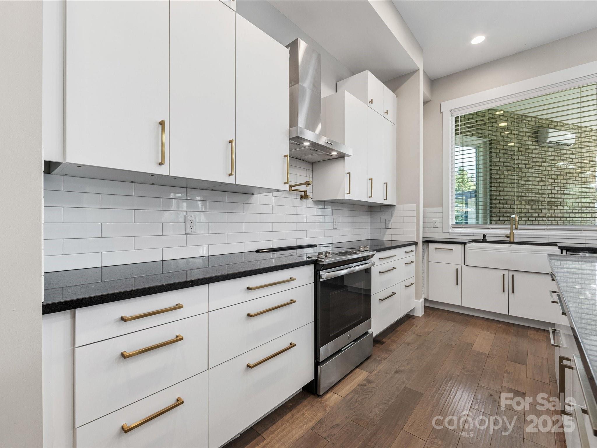 4315 Hartis Grove Church Road Indian Trail, NC 28079 - Photo 16 of 44 a kitchen with granite countertop white cabinets and white appliances