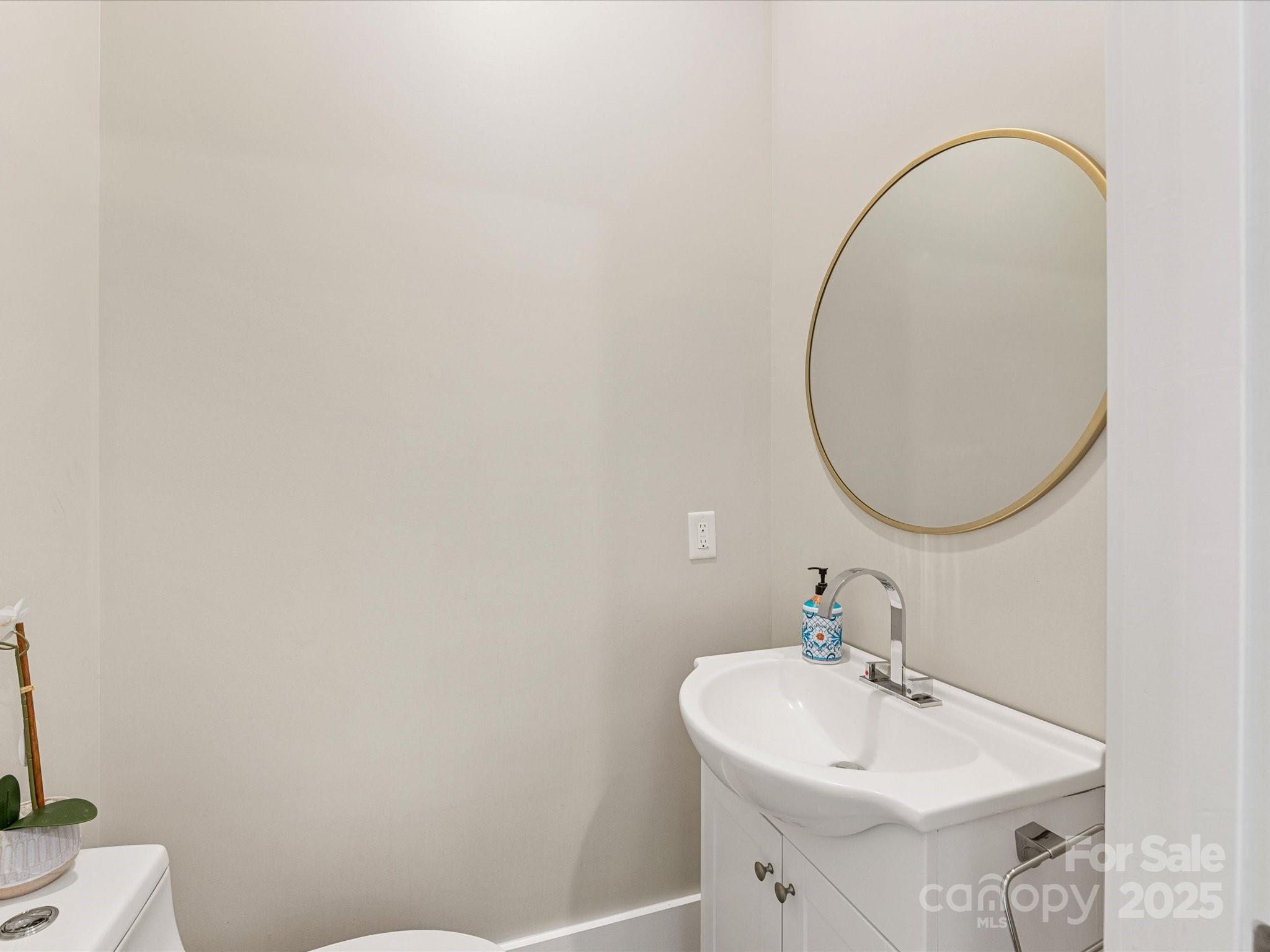 4315 Hartis Grove Church Road Indian Trail, NC 28079 - Photo 19 of 44 a bathroom with a sink a mirror and a toilet