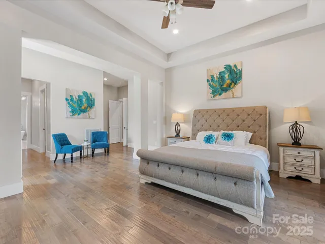 a bedroom with a bed and a table