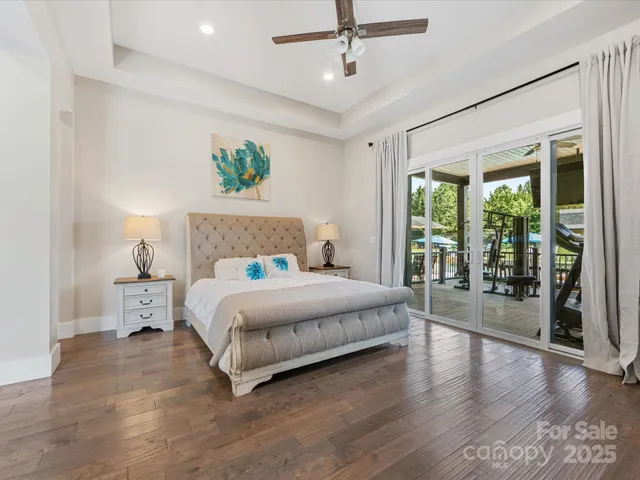 a bedroom with a large bed and a large window