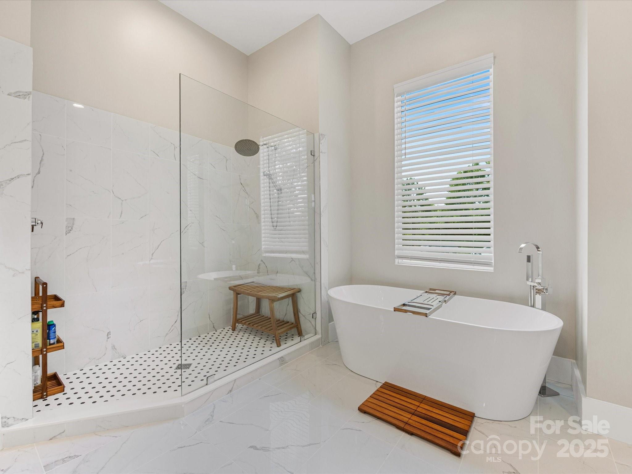 4315 Hartis Grove Church Road Indian Trail, NC 28079 - Photo 29 of 44 a spacious bathroom with a bathtub and next to a window