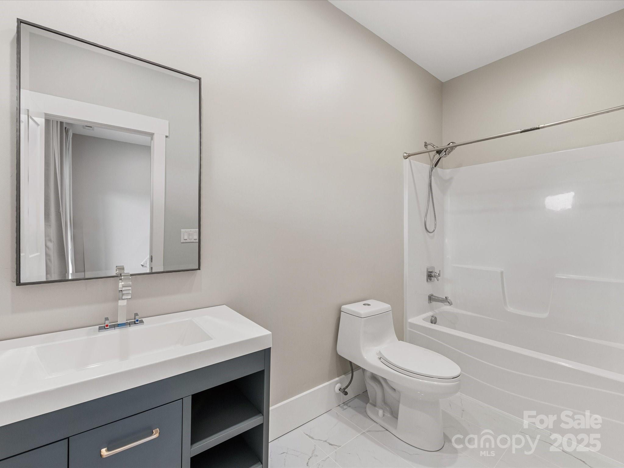 4315 Hartis Grove Church Road Indian Trail, NC 28079 - Photo 38 of 44 a bathroom with a sink a toilet and shower