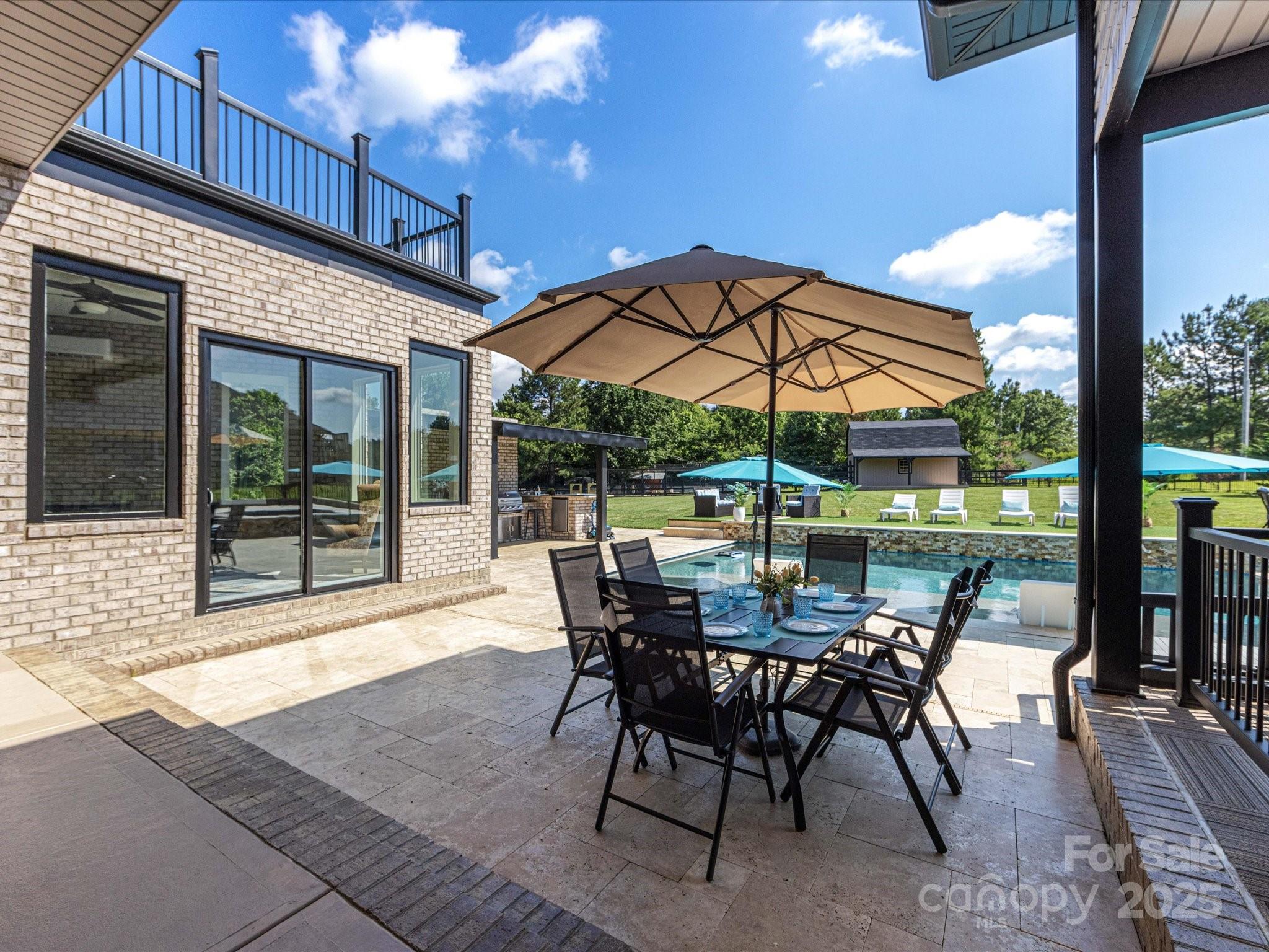 4315 Hartis Grove Church Road Indian Trail, NC 28079 - Photo 5 of 44 a view of a patio with a table and chairs