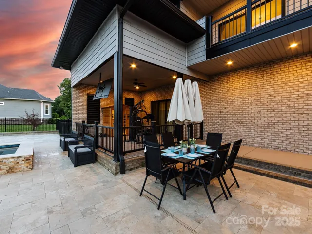 a view of a patio with a table and chairs