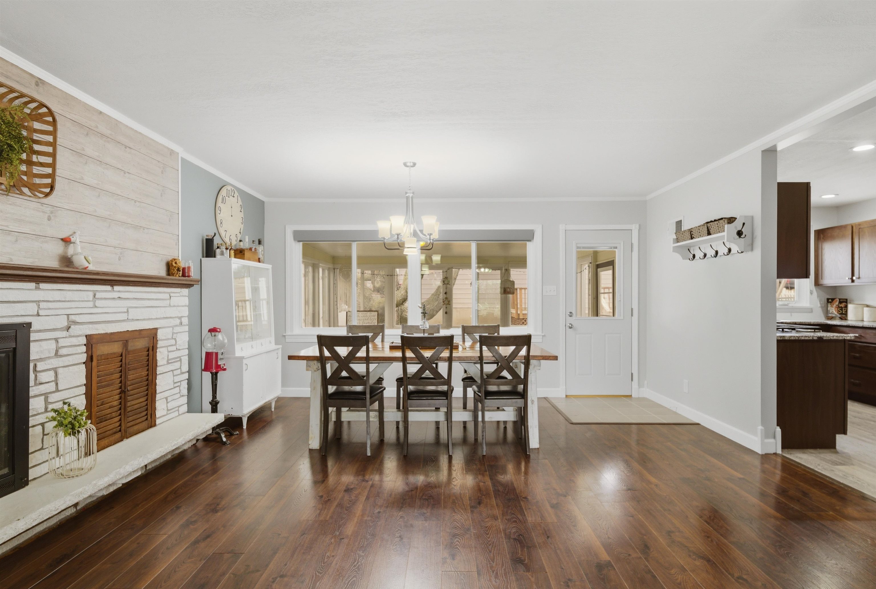 923 Institute Boulevard Dixon, IL 61021 - Photo 13 of 37 a dining room with furniture fireplace and wooden floor