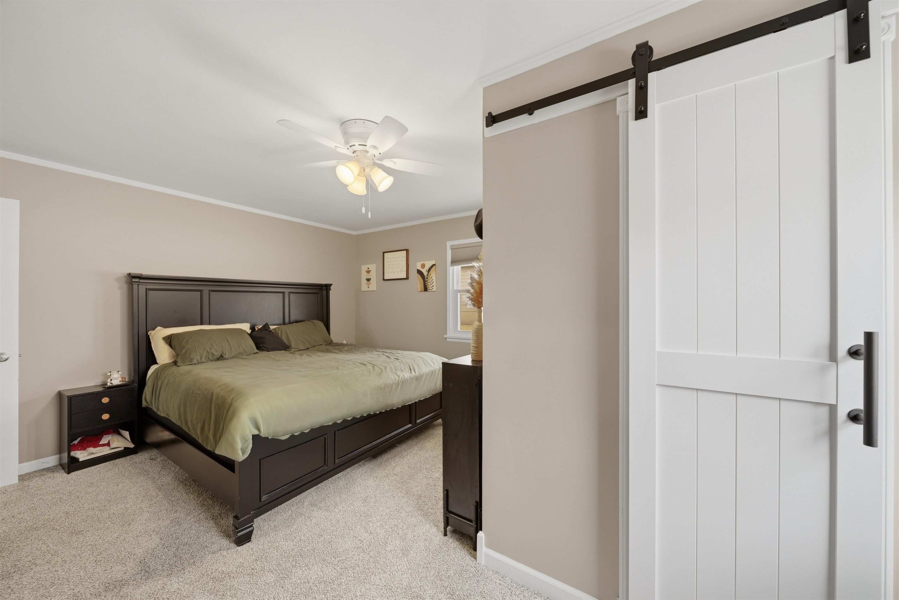 923 Institute Boulevard Dixon, IL 61021 - Photo 22 of 37 a bedroom with a bed and a chandelier