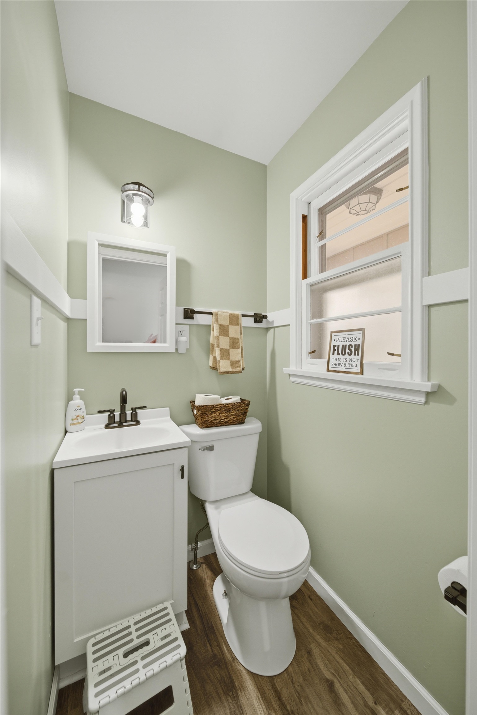 923 Institute Boulevard Dixon, IL 61021 - Photo 26 of 37 a bathroom with a toilet sink and mirror