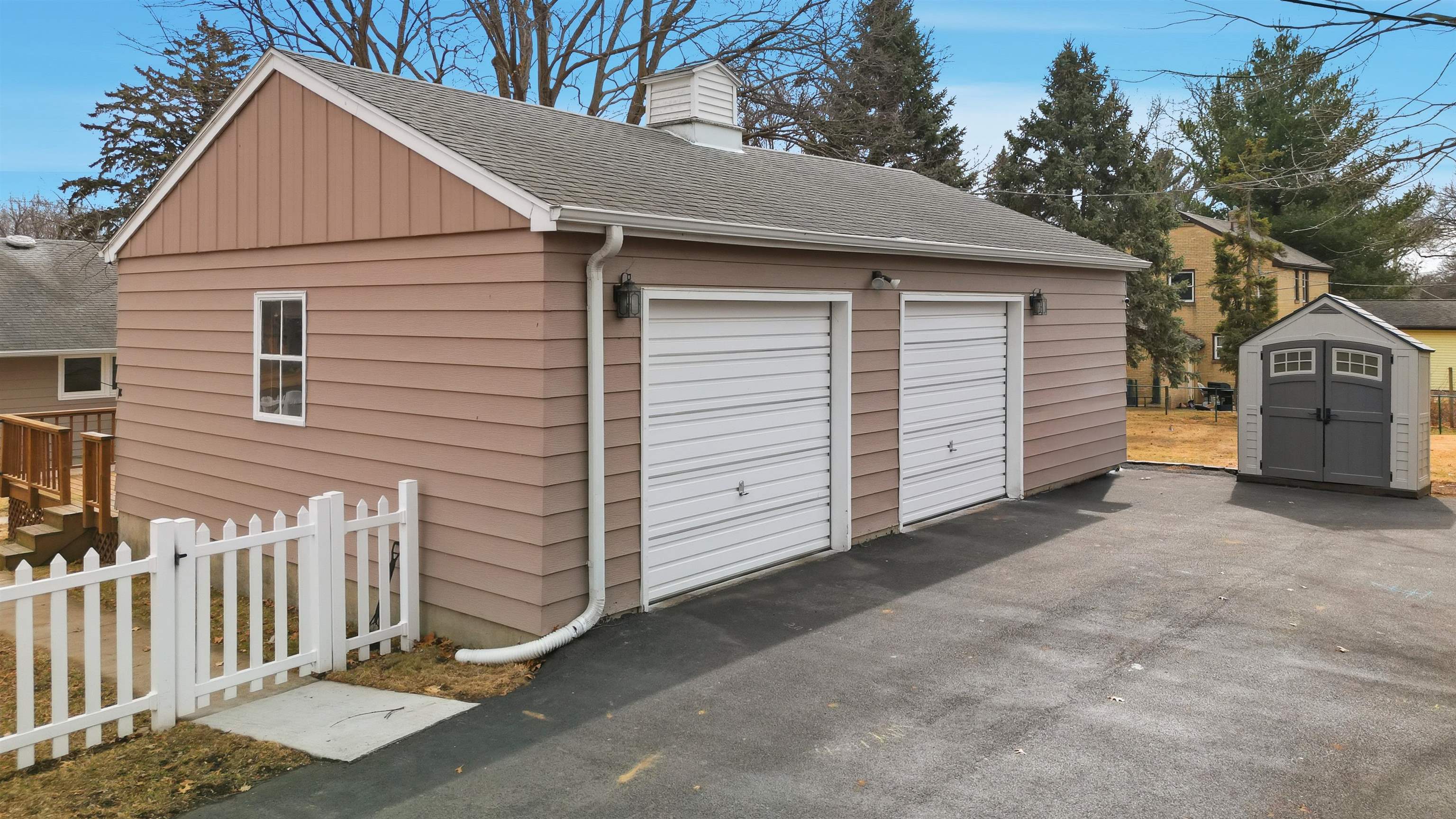 923 Institute Boulevard Dixon, IL 61021 - Photo 6 of 37 a view of a house with a garage and yard