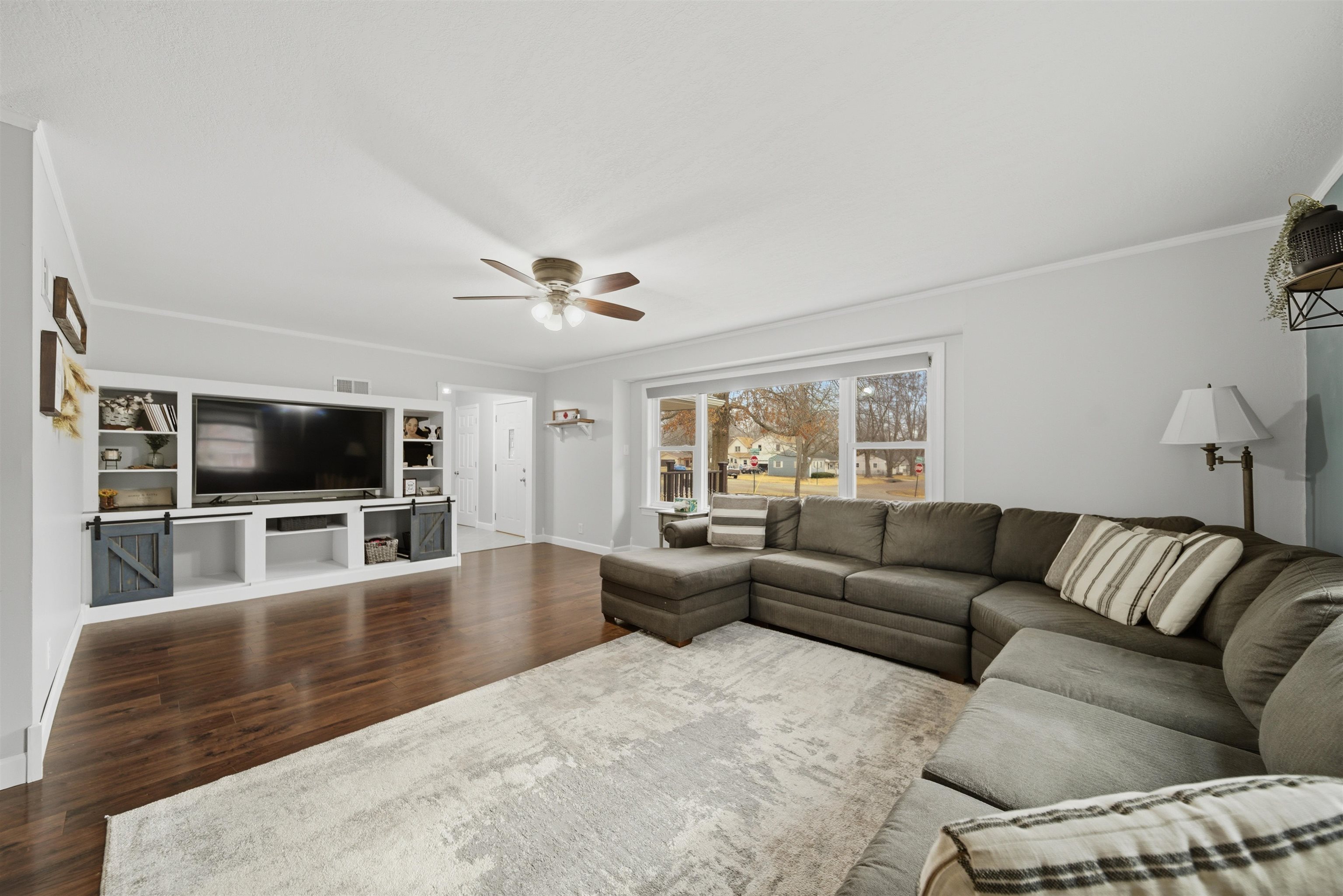 923 Institute Boulevard Dixon, IL 61021 - Photo 10 of 37 a living room with furniture and a flat screen tv