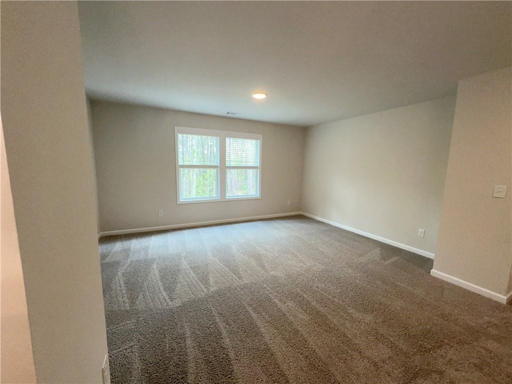 345 Rodeo Drive Auburn, GA 30011 - Photo 13 of 22 an empty room with a window