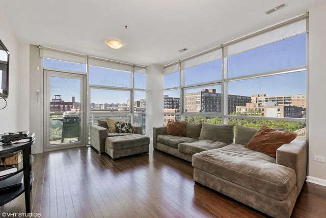 225 South Sangamon Street, Unit 512 Chicago, IL 60607 - Photo 2 of 11 a living room with furniture and a large window