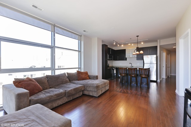 225 South Sangamon Street, Unit 512 Chicago, IL 60607 - Photo 3 of 11 a living room with furniture and a large window