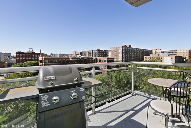 225 South Sangamon Street, Unit 512 Chicago, IL 60607 - Photo 10 of 11 a view of a chairs and table in a terrace