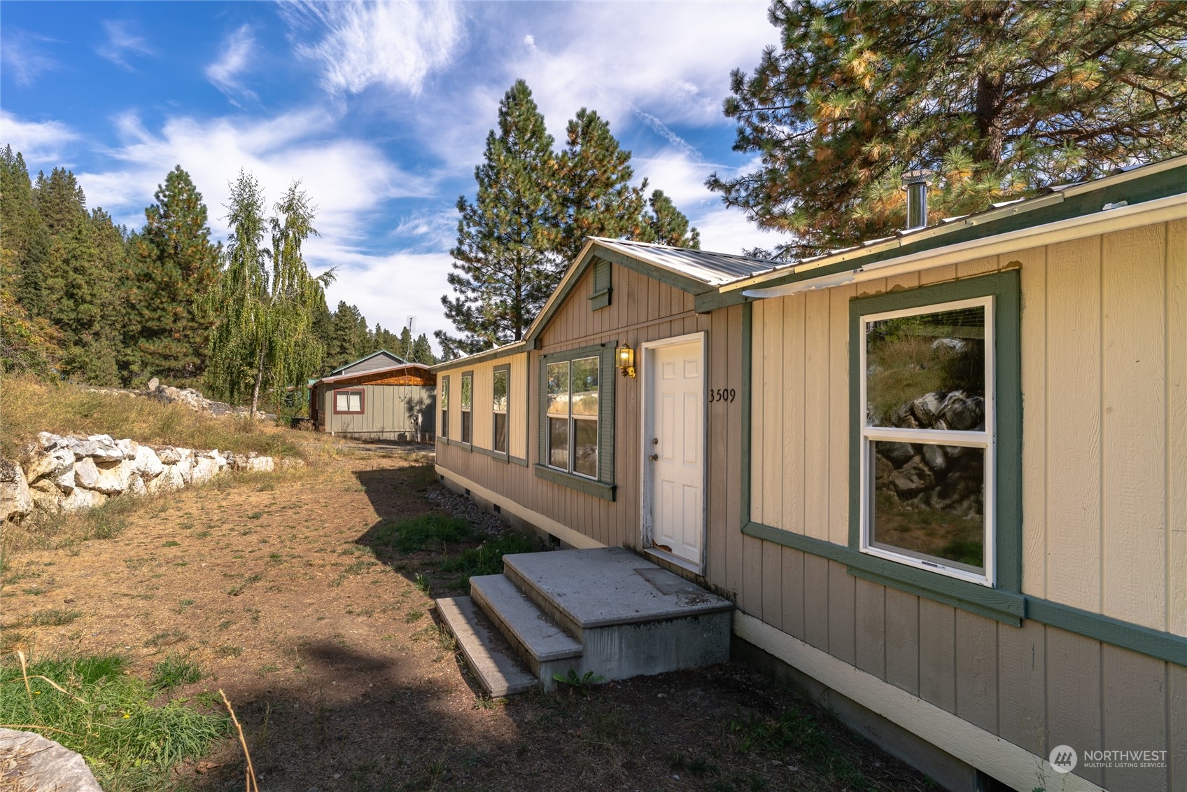 3509 Hansel Lane Peshastin, WA 98847 - Photo 1 of 33 a view of a house with backyard and sitting area