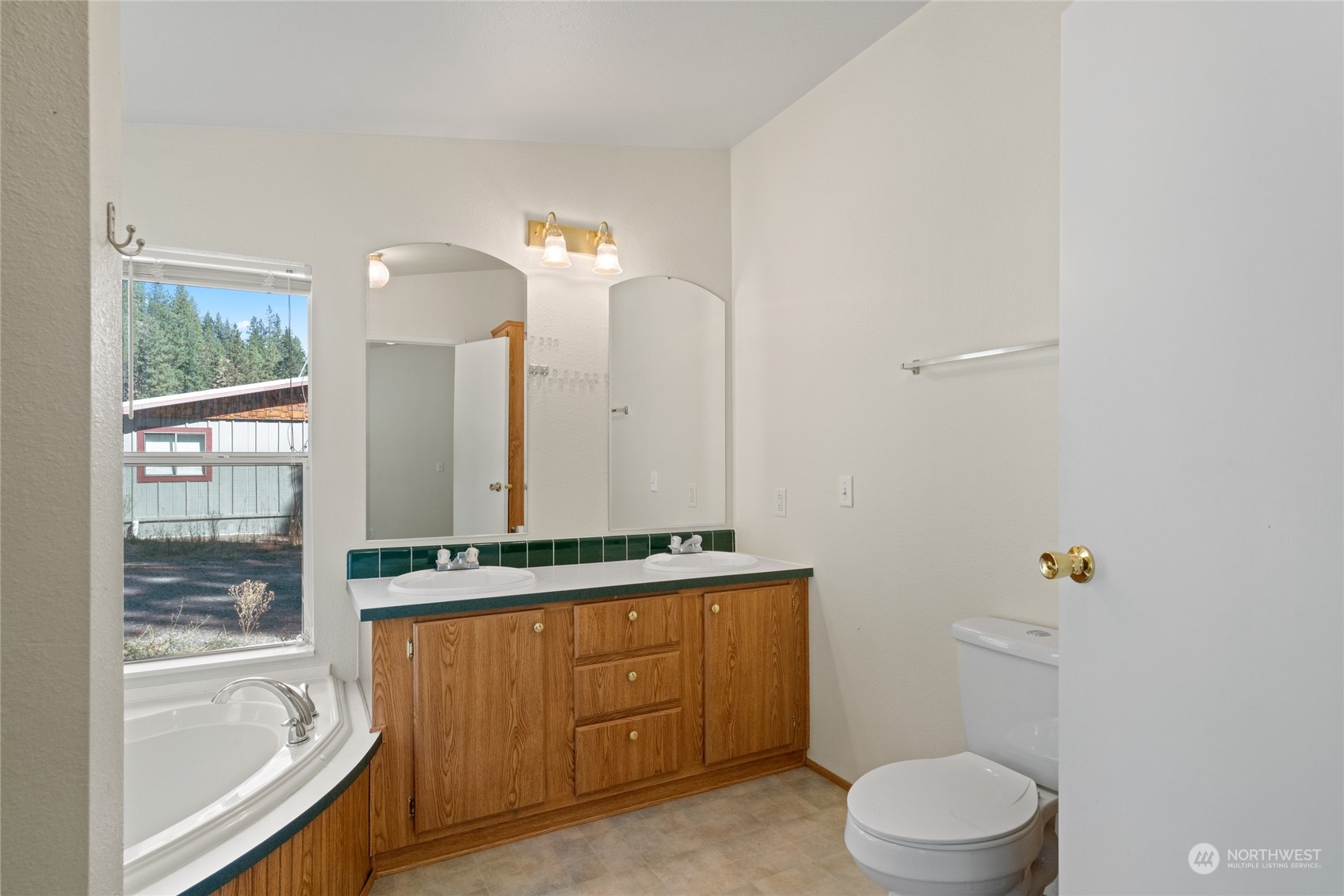 3509 Hansel Lane Peshastin, WA 98847 - Photo 17 of 33 a bathroom with a granite countertop sink a toilet and bathtub