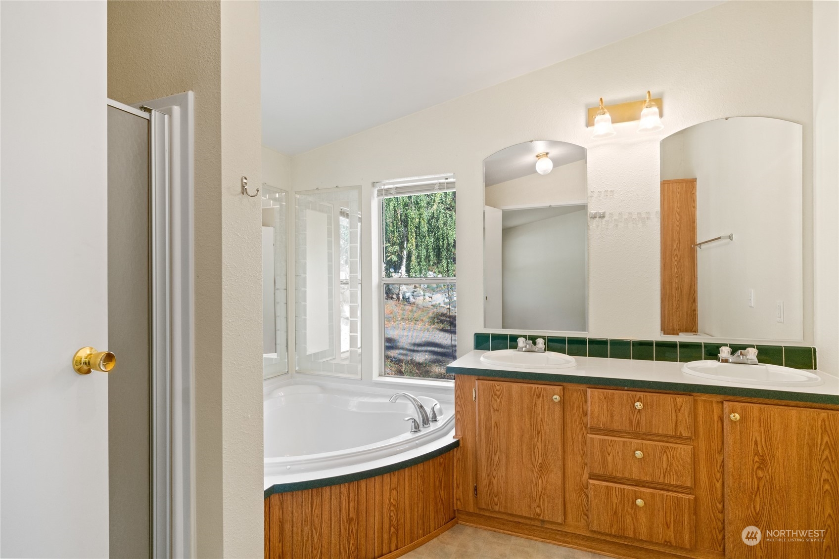 3509 Hansel Lane Peshastin, WA 98847 - Photo 18 of 33 a bathroom with a granite countertop sink and a mirror