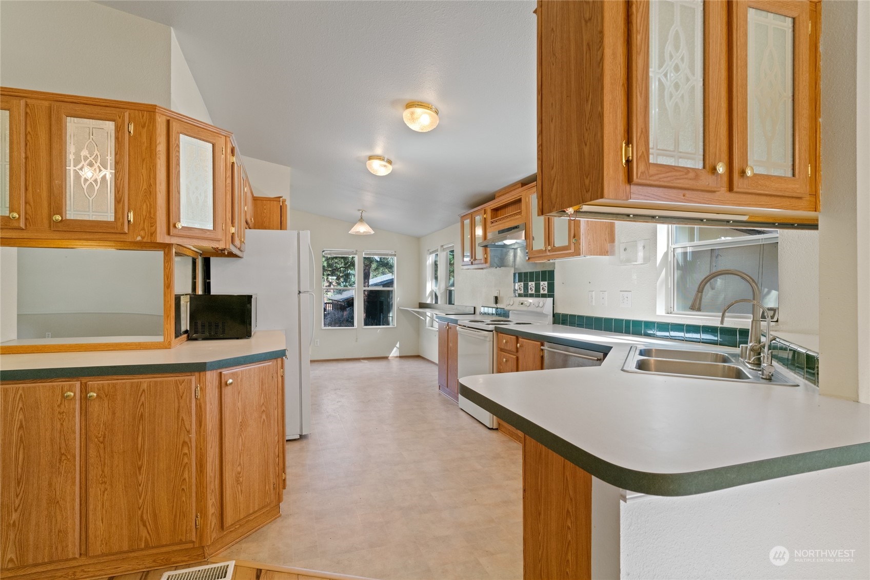 3509 Hansel Lane Peshastin, WA 98847 - Photo 5 of 33 a kitchen with stainless steel appliances granite countertop a sink a stove and a refrigerator