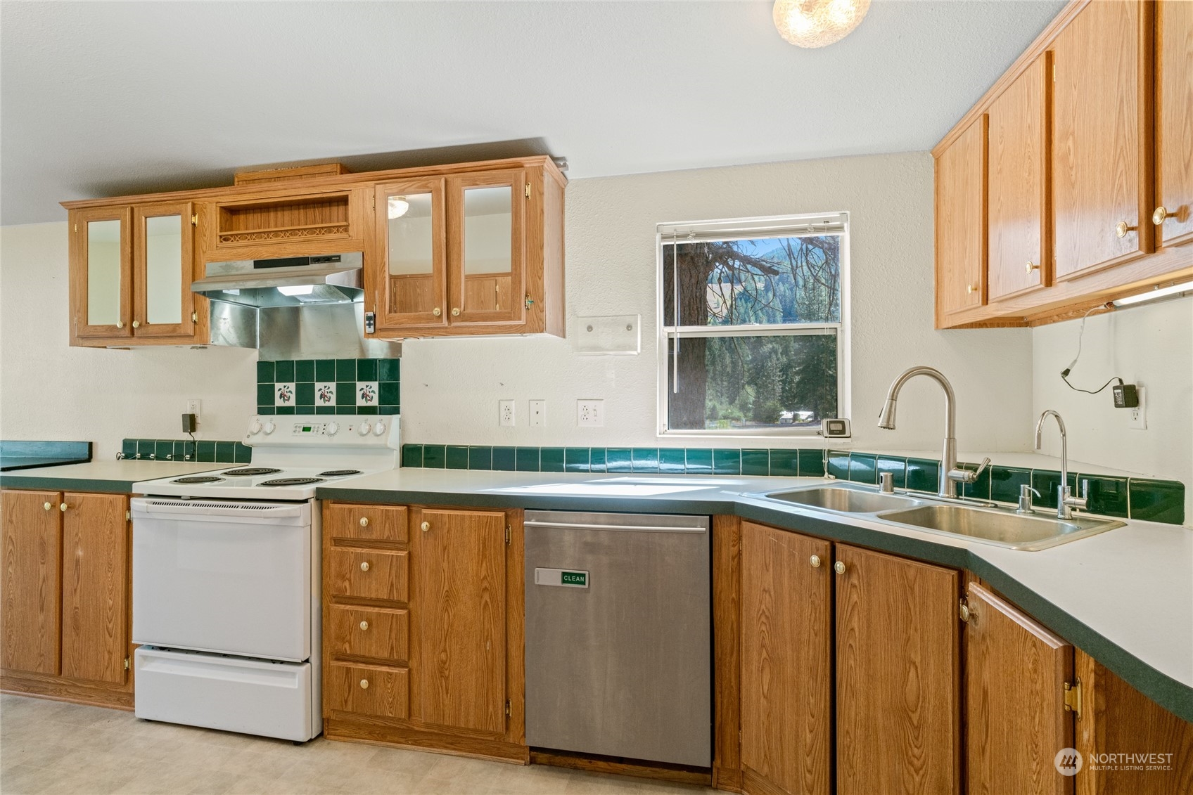 3509 Hansel Lane Peshastin, WA 98847 - Photo 6 of 33 a kitchen with granite countertop cabinets stainless steel appliances a sink and a window