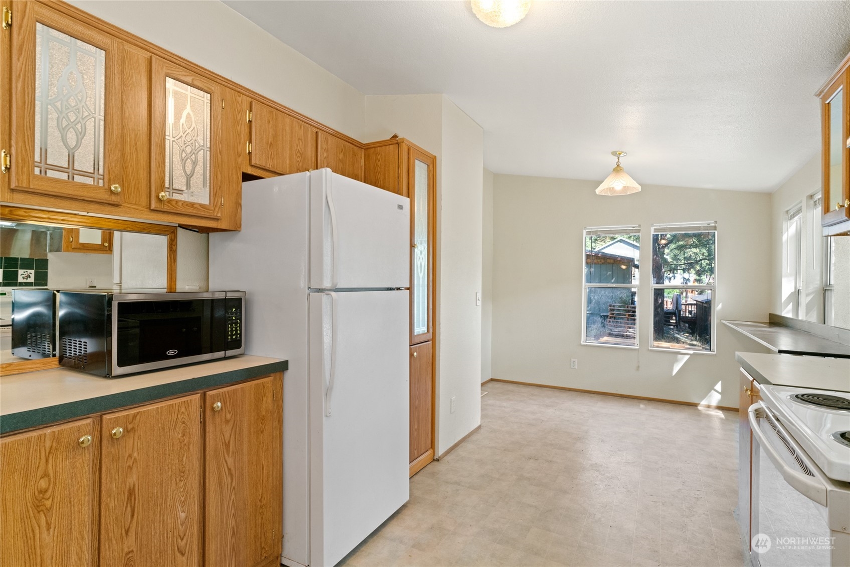 3509 Hansel Lane Peshastin, WA 98847 - Photo 7 of 33 a kitchen with stainless steel appliances a refrigerator a stove a microwave and cabinets