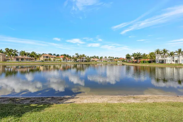 a view of a lake with houses in the back
