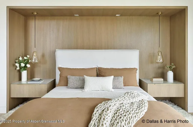 a living room with a large window and a couch