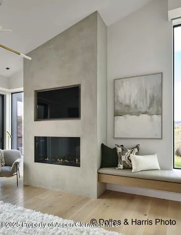 a large bathroom with a double vanity sink a large mirror and shower