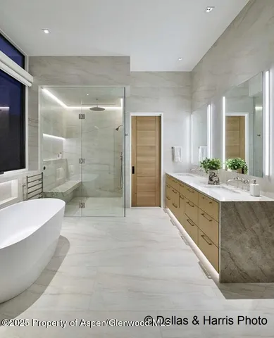 a bathroom with a bathtub and a sink