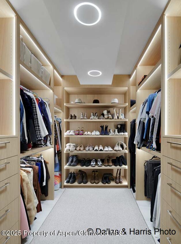 2196 Lazy O Road Snowmass, CO 81654 - Photo 29 of 59 a view of walk in closet with clothes and shoes
