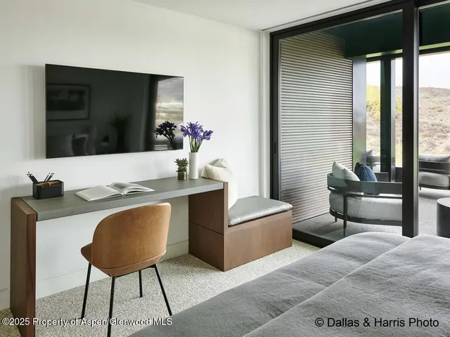 a bathroom with a toilet a sink and a mirror