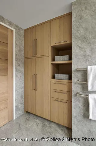 a view of entryway and hall with dining room