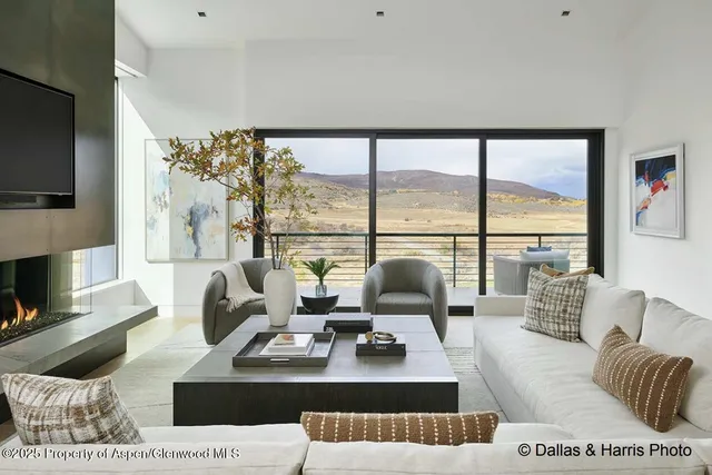 a living room with stainless steel appliances kitchen island granite countertop furniture and a kitchen view