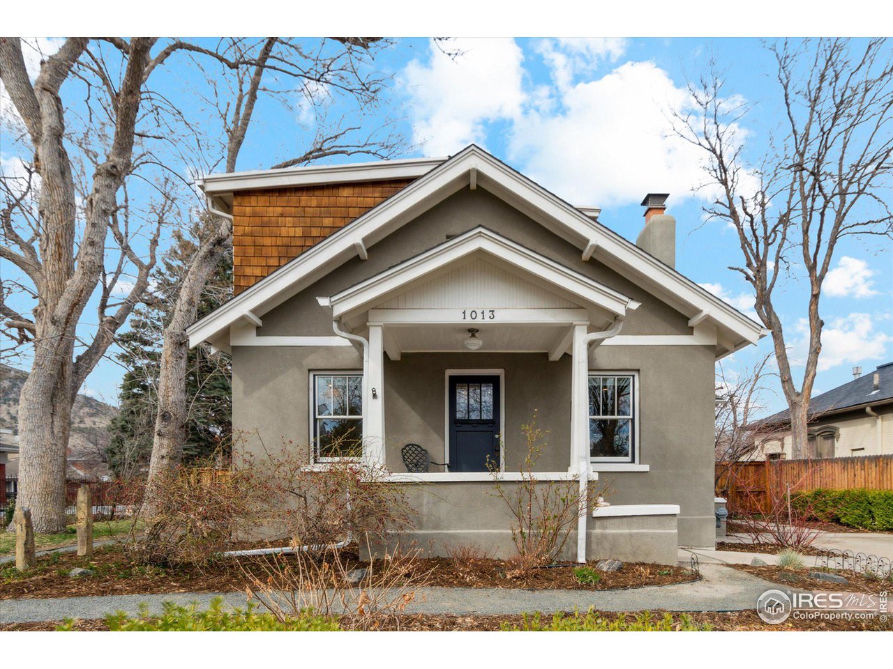 1013 Mapleton Avenue Boulder, CO 80304 - Photo 1 of 37 a front view of a house with garden