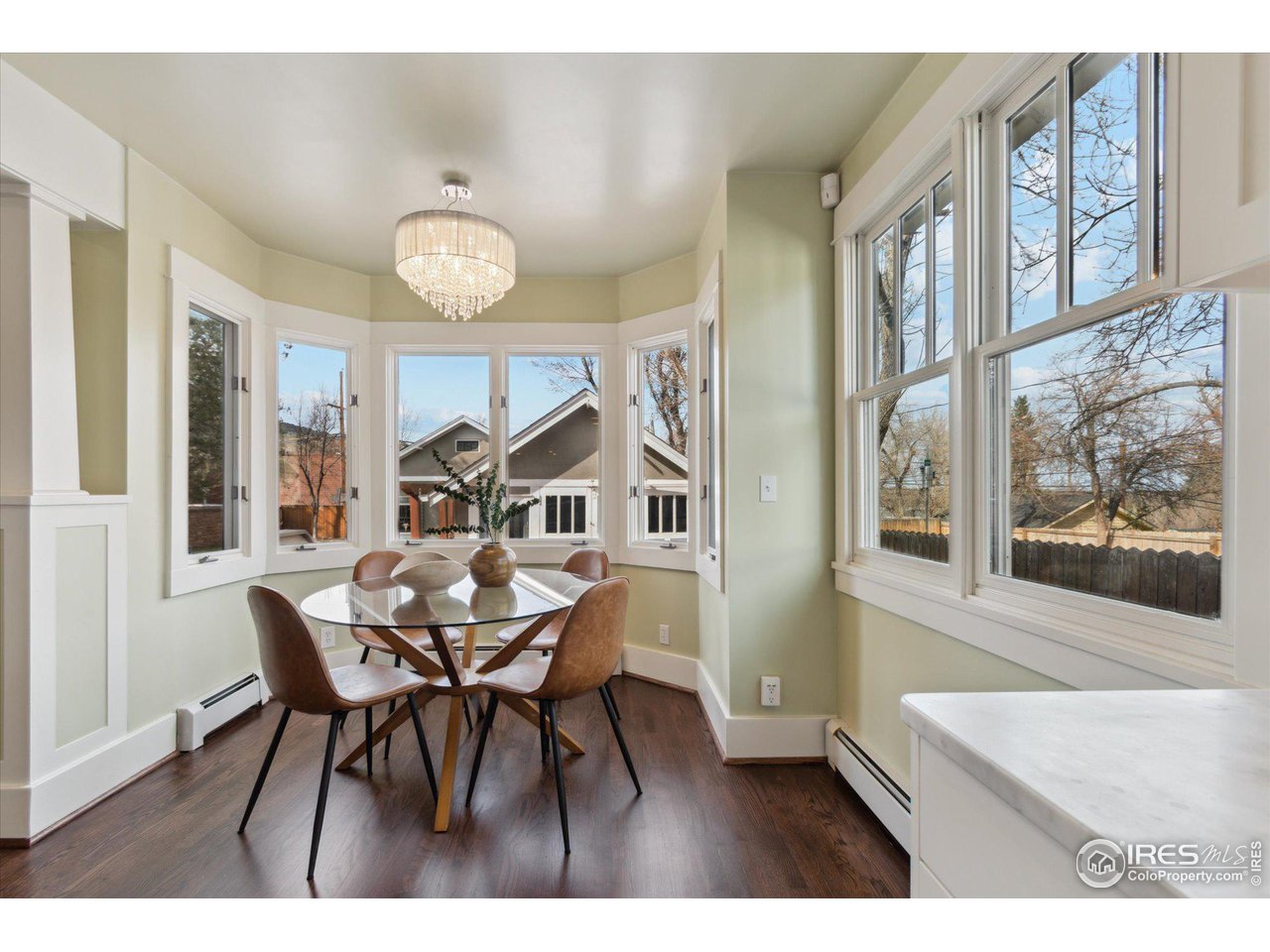 1013 Mapleton Avenue Boulder, CO 80304 - Photo 13 of 37 a view of a dining room with furniture and wooden floor