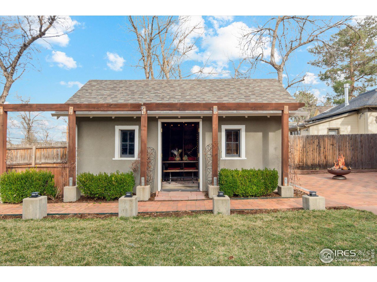 1013 Mapleton Avenue Boulder, CO 80304 - Photo 20 of 37 a view of a house with a yard and plants