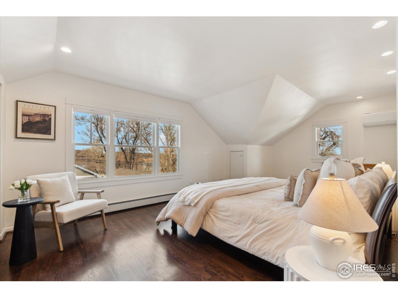 1013 Mapleton Avenue Boulder, CO 80304 - Photo 24 of 37 a bedroom with a bed and a painting on the wall