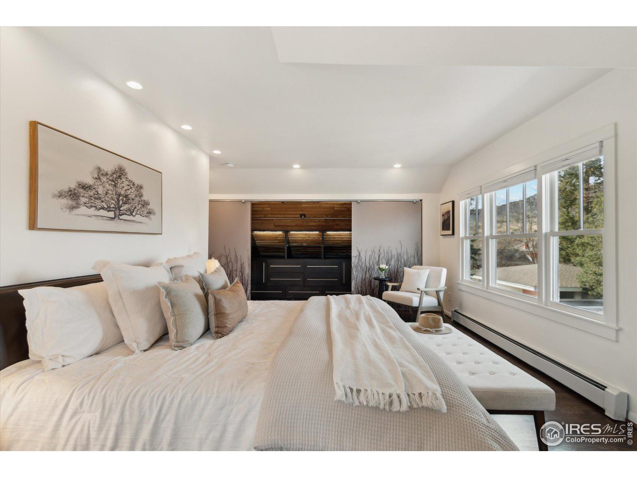 1013 Mapleton Avenue Boulder, CO 80304 - Photo 26 of 37 a bedroom with a large bed and a large window