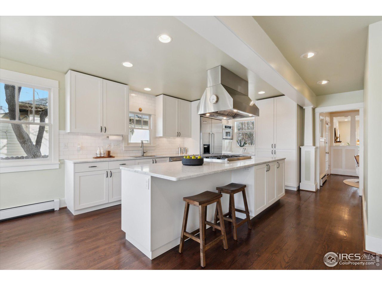 1013 Mapleton Avenue Boulder, CO 80304 - Photo 7 of 37 a kitchen with a sink cabinets and wooden floor
