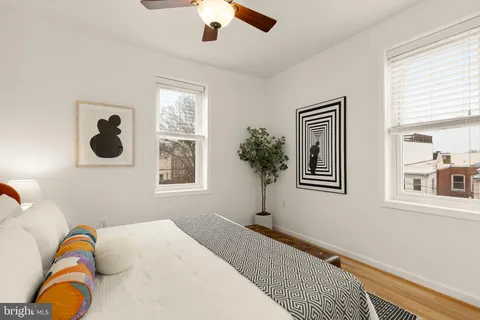 a bedroom with a bed and a window