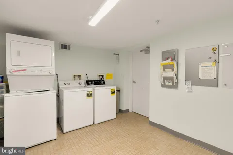 a kitchen with cabinets and white appliances
