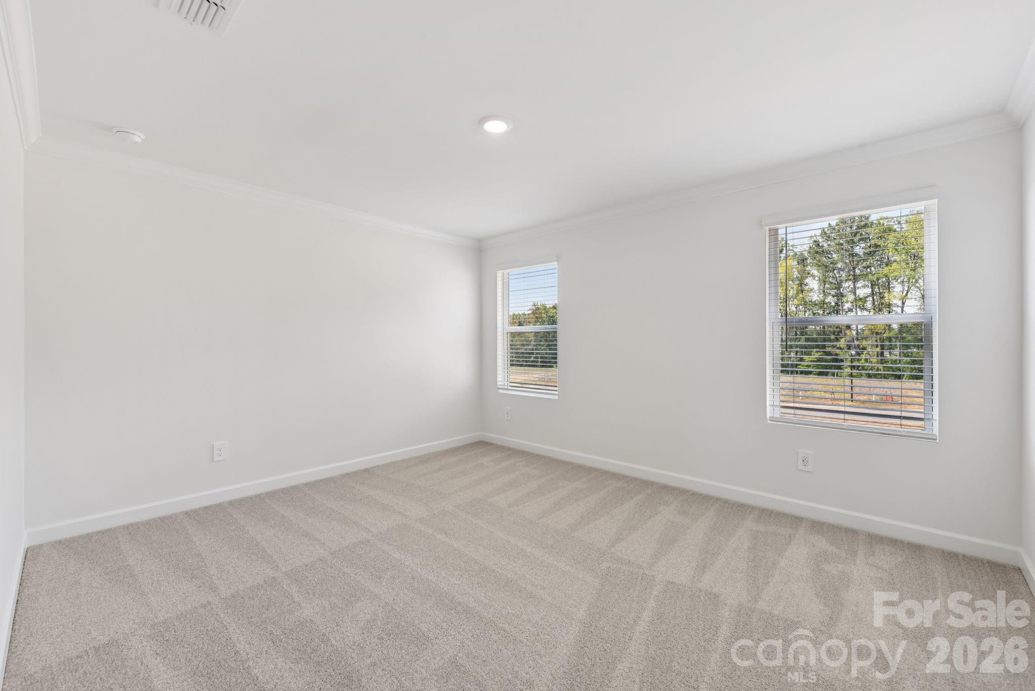 218 Tiger Lily Drive Fort Mill, SC 29708 - Photo 12 of 15 an empty room with windows