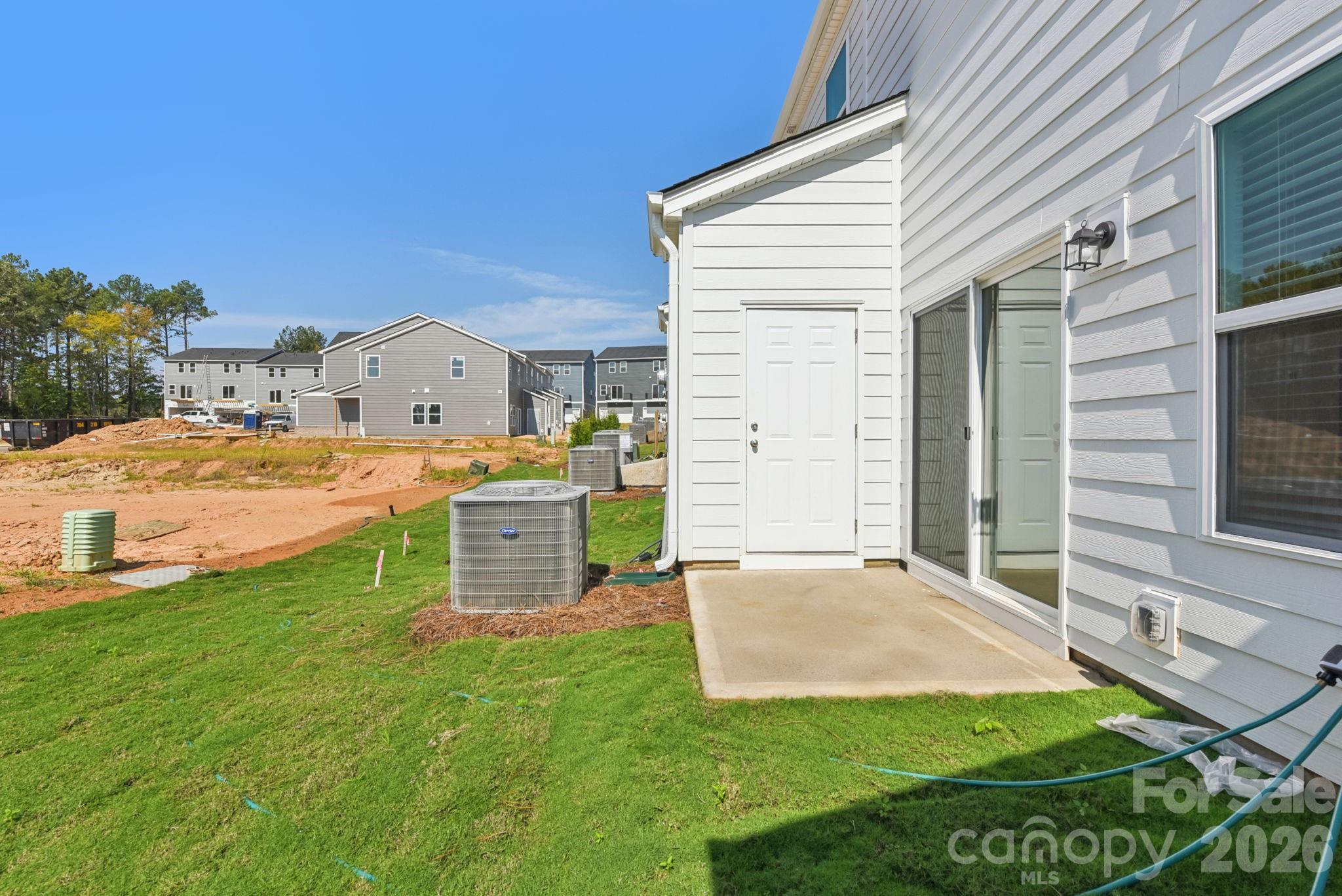 218 Tiger Lily Drive Fort Mill, SC 29708 - Photo 15 of 15 a view of a house with a yard and a garage