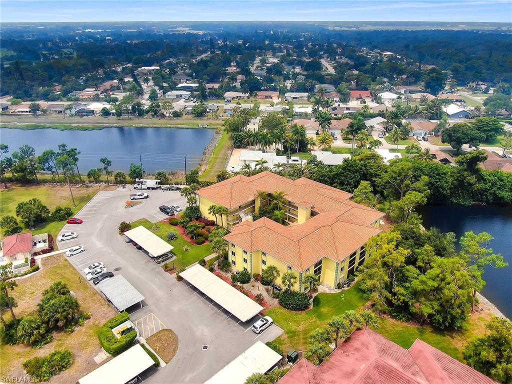 1001 Foxfire Lane, Unit 204 Naples, FL 34104 - Photo 17 of 22 an aerial view of a house with a lake view