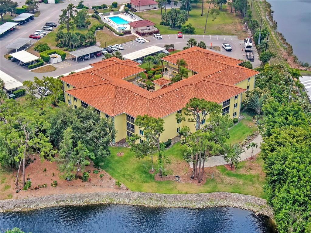 1001 Foxfire Lane, Unit 204 Naples, FL 34104 - Photo 21 of 22 an aerial view of a house with yard swimming pool and outdoor seating