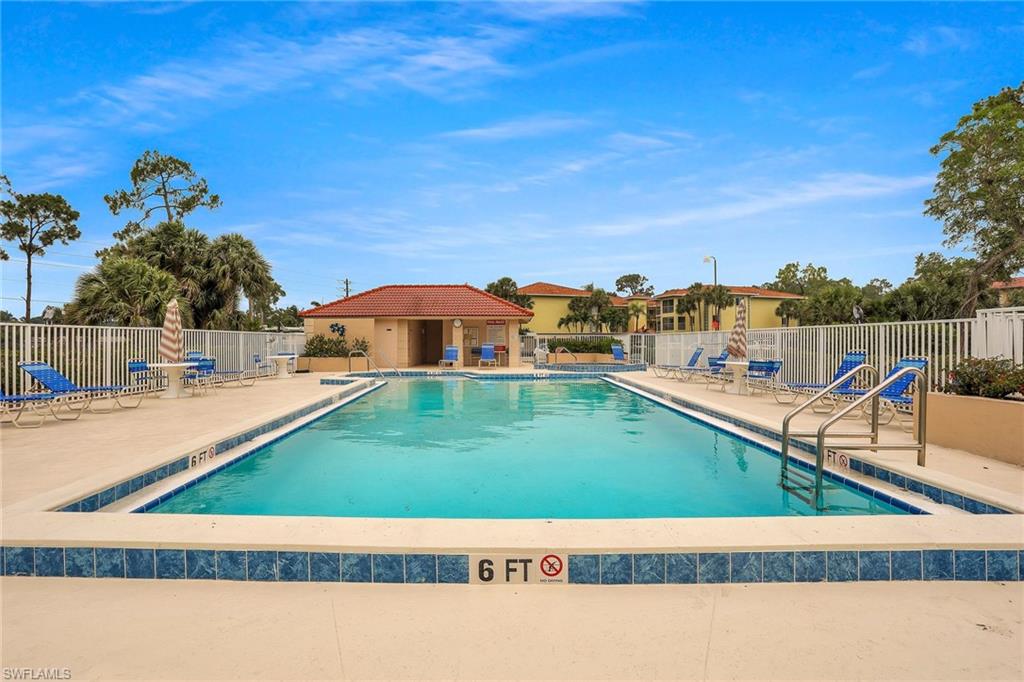 1001 Foxfire Lane, Unit 204 Naples, FL 34104 - Photo 22 of 22 a view of swimming pool from a balcony