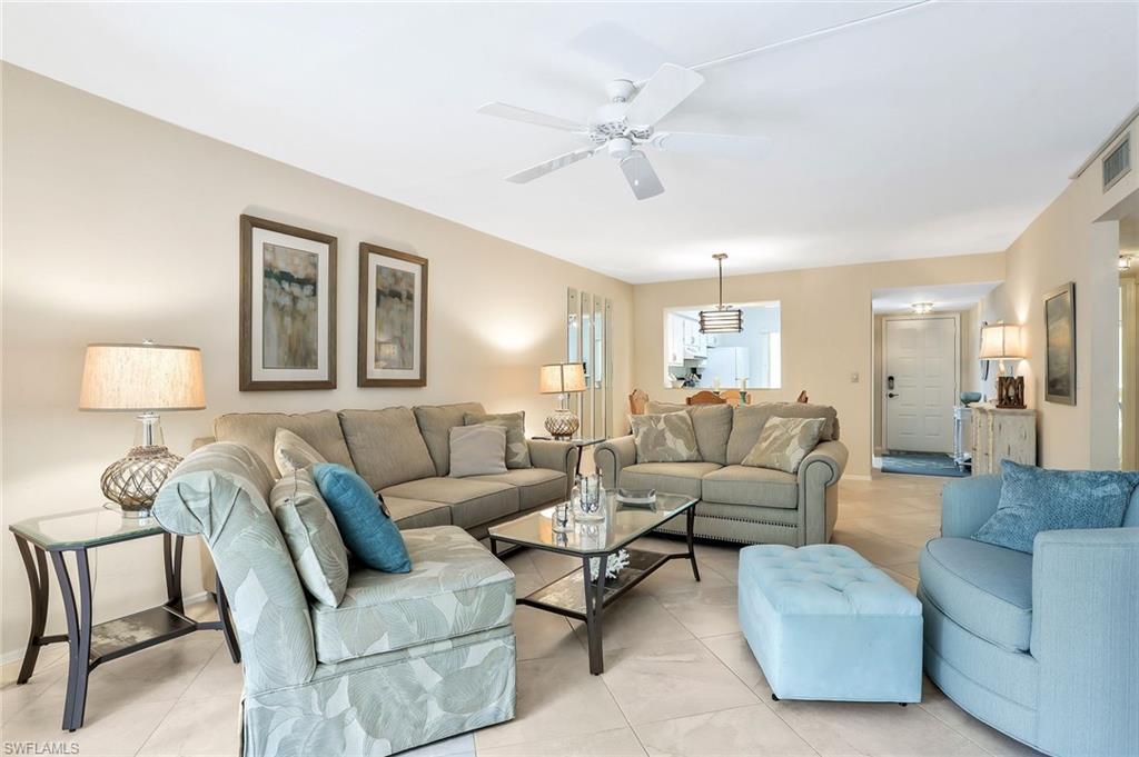 1001 Foxfire Lane, Unit 204 Naples, FL 34104 - Photo 4 of 22 a living room with furniture